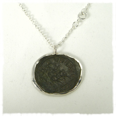 Bronze Roman coin in  silver mount